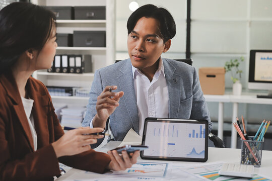 Business professional analyzing financial data on digital tablet dashboard with calculator and laptop, representing accounting software, ERP system integration, performance monitoring.