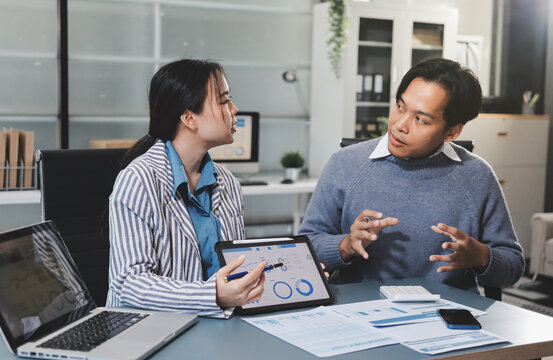 Business professional analyzing financial data on digital tablet dashboard with calculator and laptop, representing accounting software, ERP system integration, performance monitoring.