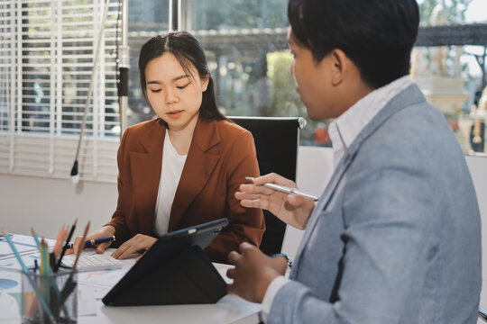 Business professional analyzing financial data on digital tablet dashboard with calculator and laptop, representing accounting software, ERP system integration, performance monitoring.