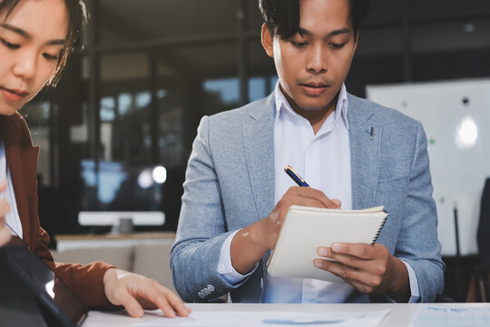Business professional analyzing financial data on digital tablet dashboard with calculator and laptop, representing accounting software, ERP system integration, performance monitoring.