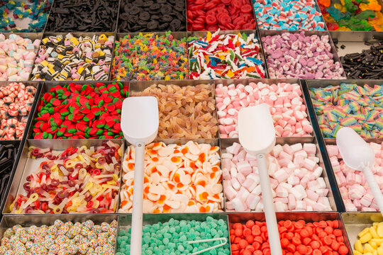 Europe, Italy, Sardinia.  A selection of sugary candy for sale at public market.