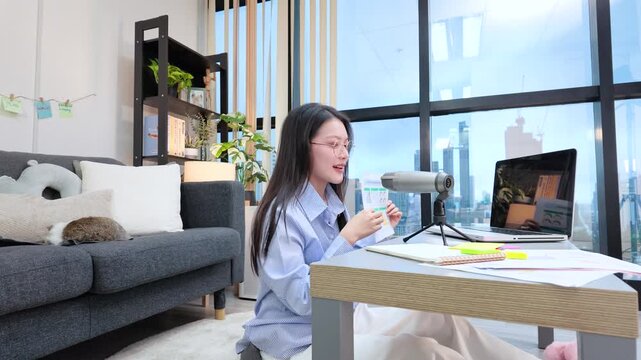 Asian Woman Giving Presentation on Video Conference from Home Office