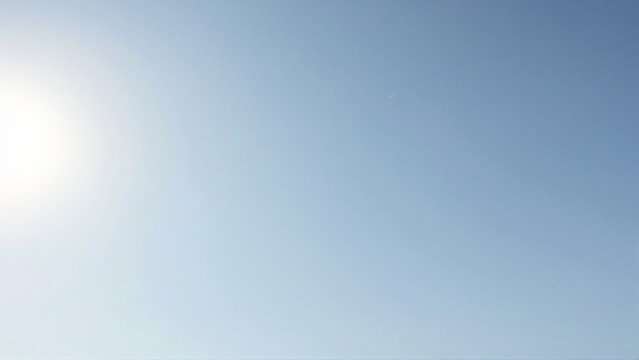 Bright Summer Sun Shining in a Clear Cloudless Blue Sky