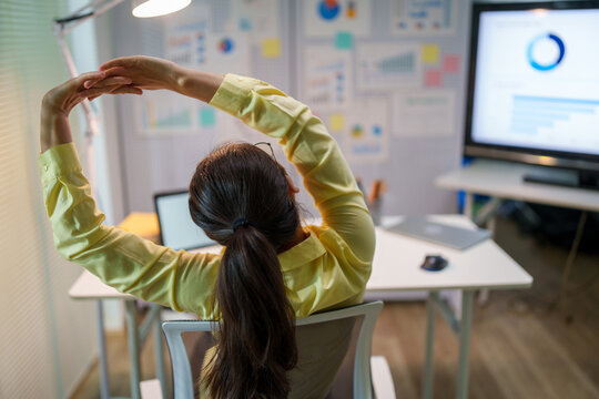 Employee stretching during work break to relieve fatigue, muscle