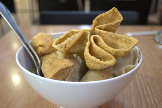 Meatball soup (bakso malang). Indonesian meatballs served with fried wonton, beef meatballs, vermicelli noodles, dumplings. 
