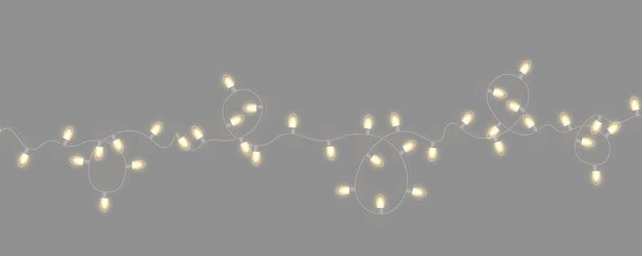 LED Christmas string lights with bright colors. Decorative garland for festive interiors and parties. Transparent PNG for seasonal graphic projects.

