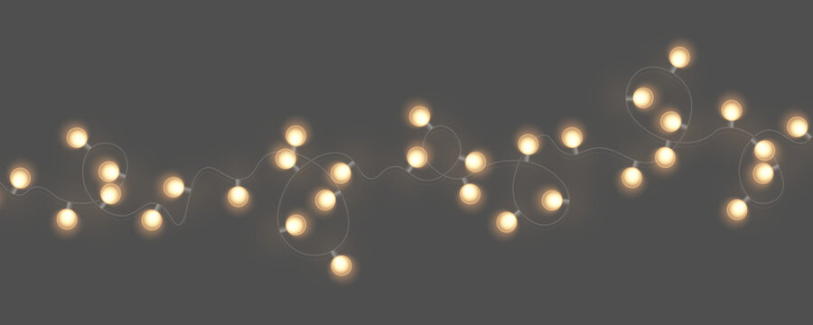 Sparkling Christmas lights with glowing bulbs. Festive garland for New Year decorations. Transparent vector elements for holiday graphics and seasonal designs.

