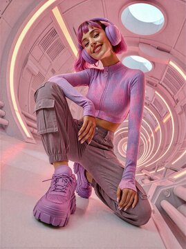 Smiling woman with headphones and pink hair in a futuristic tunnel