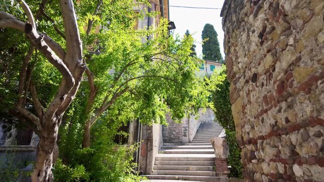 Walking up Scalinata Street toward Castel San Pietro in Verona, climbing the hillside route to reach the panoramic viewpoint overlooking the historic city