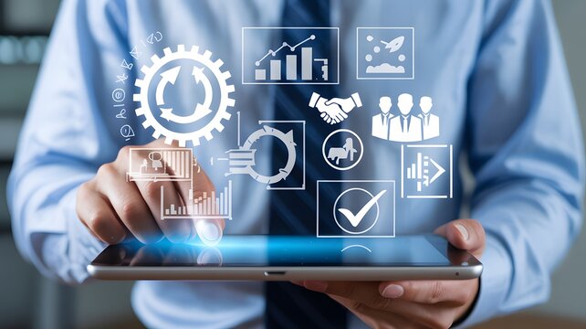 Professional Businessman Using Digital Tablet with Holographic Business Icons for Corporate Management and Strategic Planning
