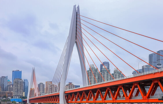 Dongshuimen Yangtze River Bridge in Chongqing, China, Modern orange steel truss bridge across Yangtze River in Chongqing, China, The iconic Dongshuimen Bridge with Chongqing city skyline in background