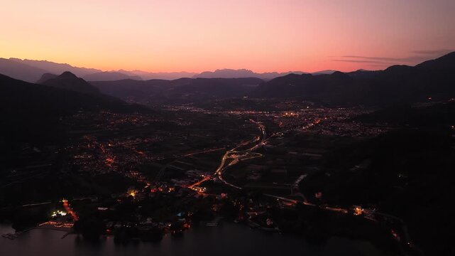 Lake Caldonazzo and Pergine Valsugana glowing beneath