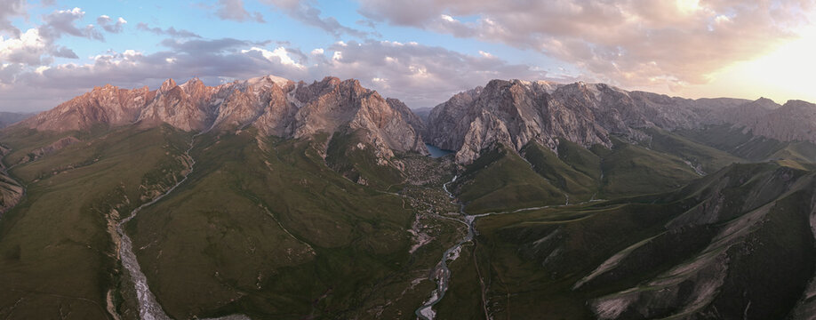 Panoramic mountain range landscape at golden hour