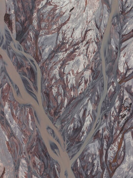 Abstract aerial view of glacial river braids from above