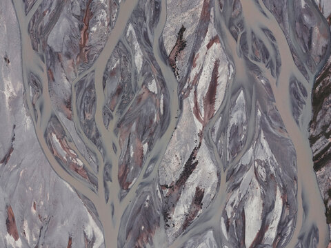 An abstract aerial view of a braided river system