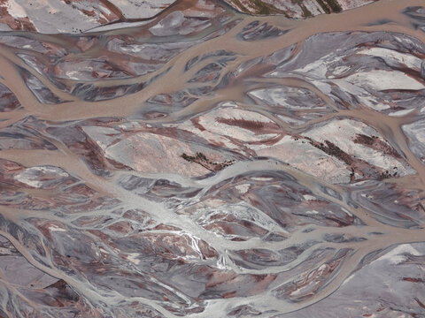 An abstract aerial view of a sprawling braided river