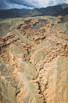 Aerial view of Charyn Canyon Kazakhstan under stormy skies