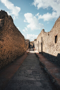 Ancient stone street and ruins in Pompeii Italy