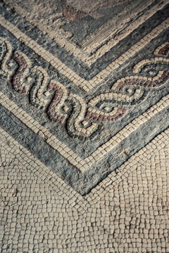 Close up detail of a weathered ancient mosaic floor