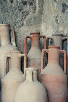 A group of ancient dusty terracotta amphorae