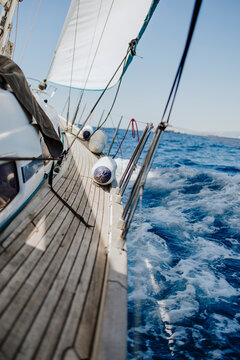 View from the deck of a sailboat sailing on the open sea