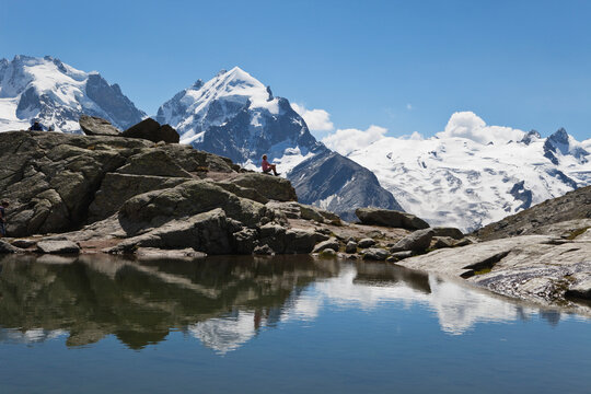 Europe, Switzerland, Grisons, South Engadin Alps, Upper Engadin, Mature woman sitting near fuorcla surley lake