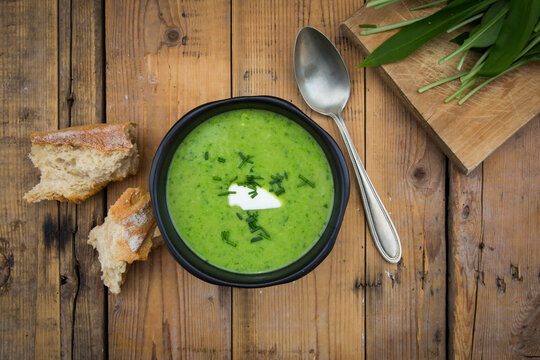 Bowls of bear's garlic soup on wood