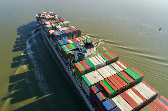 Containership transporting cargo on water in Zeeland the Netherlands