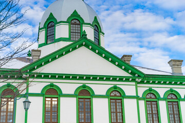 Green and white historic Western-style building in snowy Hokkaido, Japan © Bambi and Sunny