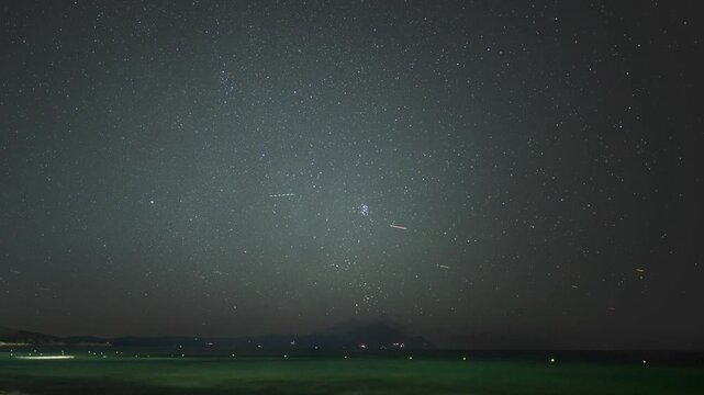 Timelapse of the Pleiades rising over Mount Athos across the sea at night, Sarti, Halkidiki, Greece