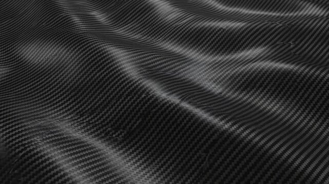 Black carbon fiber texture fabric waving in a smooth motion background