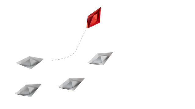 New ideas creativity and different innovative solution. Business concept. A group of paper ships, one boat is flying in the other direction, different way.
