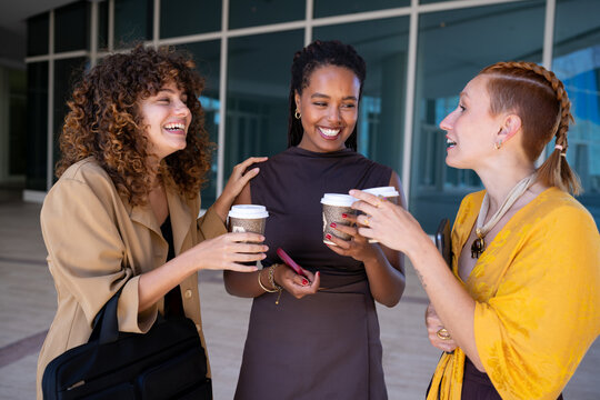 Three African American and white women enjoying coffee