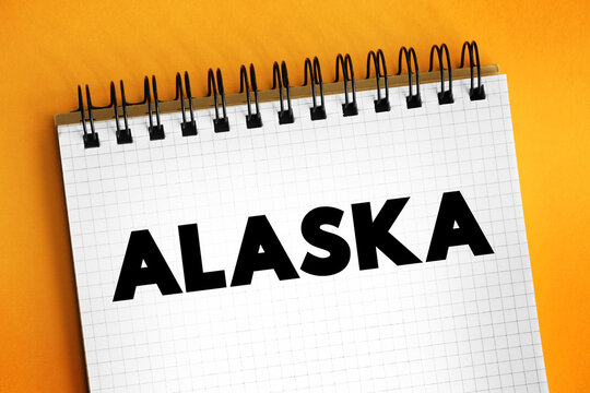 Alaska - the largest state in the United States by area, is located in the far northwest corner of North America, separated from the contiguous United States by Canada, text concept on notepad