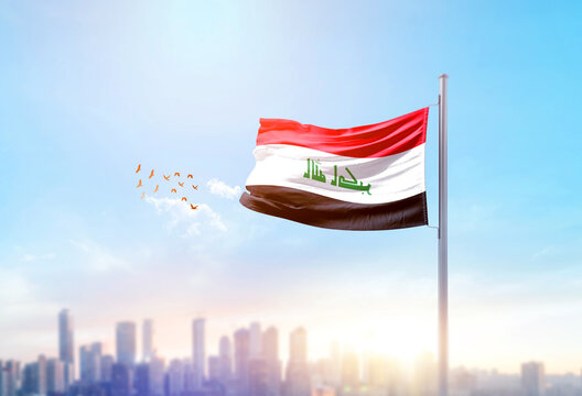 Iraq national flag waving with skyline and buildings. Iraq national flag for independence day.