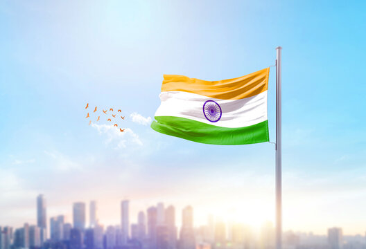 India national flag waving with skyline and buildings. India national flag for independence day.