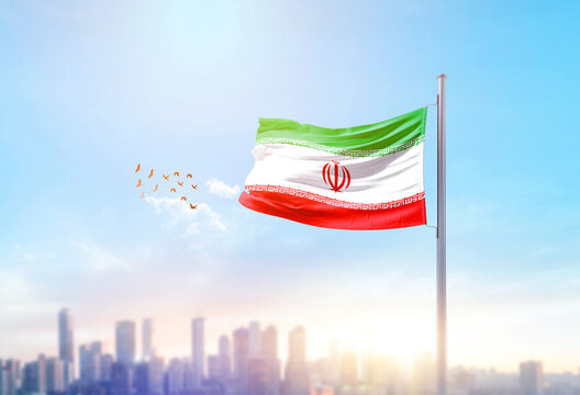 Iran national flag waving with skyline and buildings. Iran national flag for independence day.