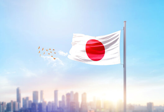 Japan national flag waving with skyline and buildings. Japan national flag for independence day.