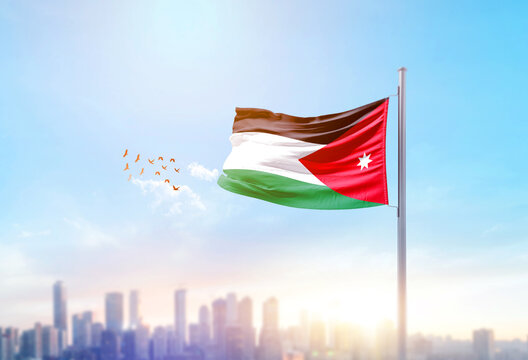 Jordan national flag waving with skyline and buildings. Jordan national flag for independence day.