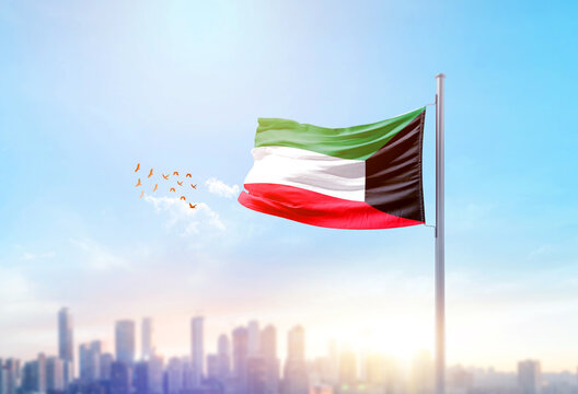 Kuwait national flag waving with skyline and buildings. Kuwait national flag for independence day.