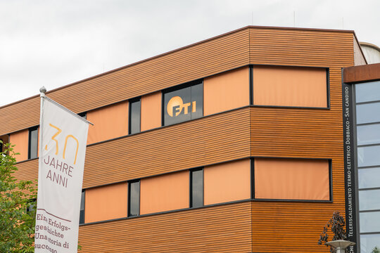 26 July 2026, Toblach, Italy. FTI Fernheizkraftwerk Toblach-Innichen energy facility with 30th anniversary banner