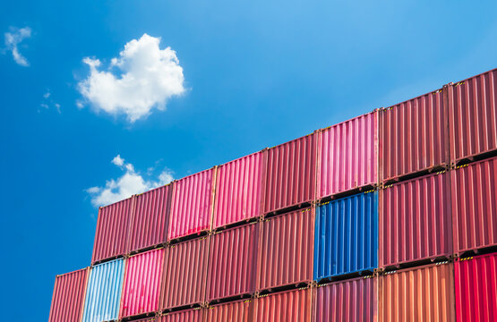 Cargo ship container goods export import international transport on blue sky background, warehouse industry business logistics transportation harbor port industrial shipping terminal cargo ship.