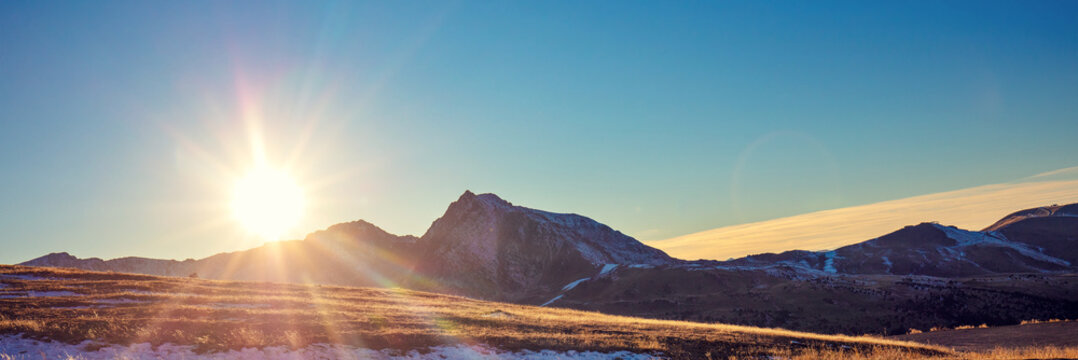 Mountain landscape with blue clear sky during sunset in autumn. Hiking The Pyrenees Mountains In Andorra