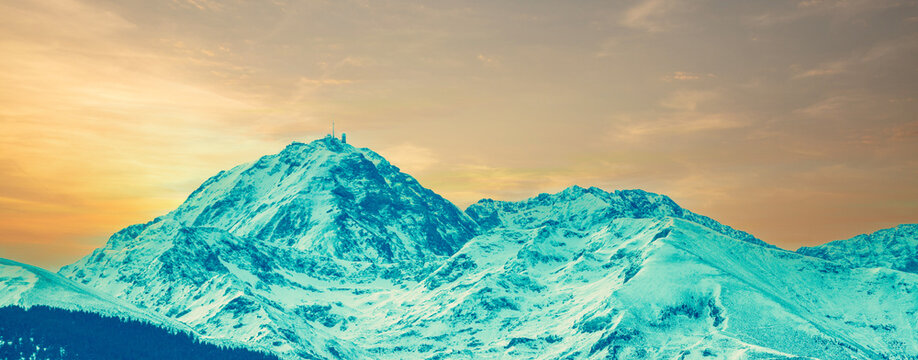 Mountain landscape in autumn. View of a mountain range covered with snow during sunset, Pyrenees, Andorra, Europe