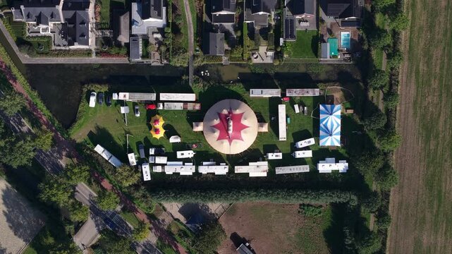 Aerial View of Circus Tent Surrounded by Trailers and Caravans