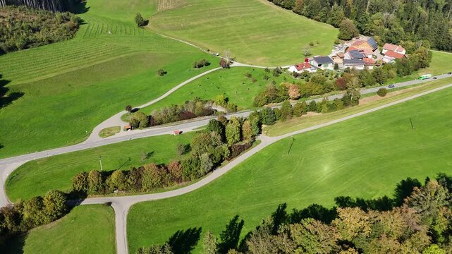 Aerial View of Highway Traffic in Southern Germany. Drone aerial view of highway traffic, road intersections, and green fields near Amtzell between Ravensburg and Wangen in southern Germany during ear