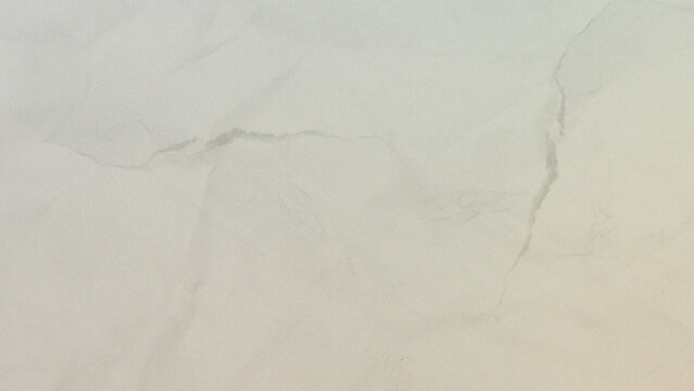 Abstract texture of warm beige crumpled paper surface with a close up view of a beige colored paper with a delicate wrinkled