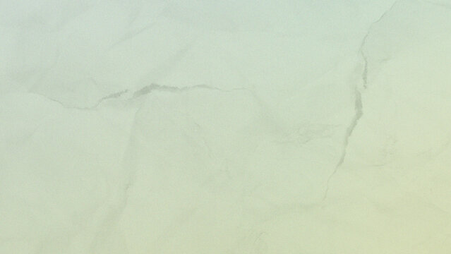 Abstract texture of soft olive green crumpled paper surface with a close up view of a muted green paper with a delicate