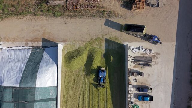 Aerial Top View Cattle Feed Storage and Silage Preparation at Italian Farm in Lombardy