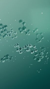 Vertical video: Moving camera drawing glass clusters at teal backdrop, revealing chain details